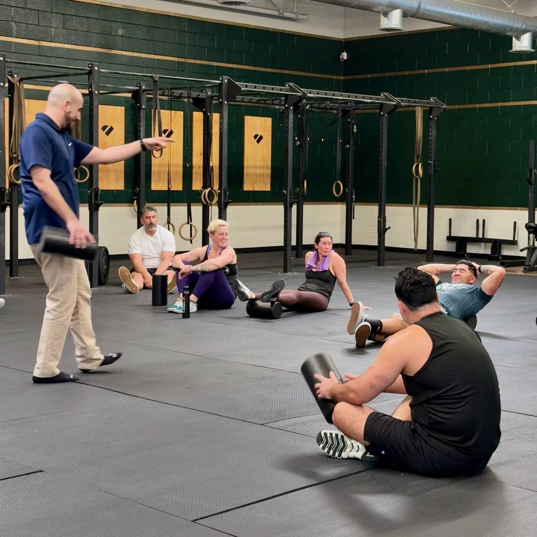 Dr. Armen coaching a gym group during a workshop